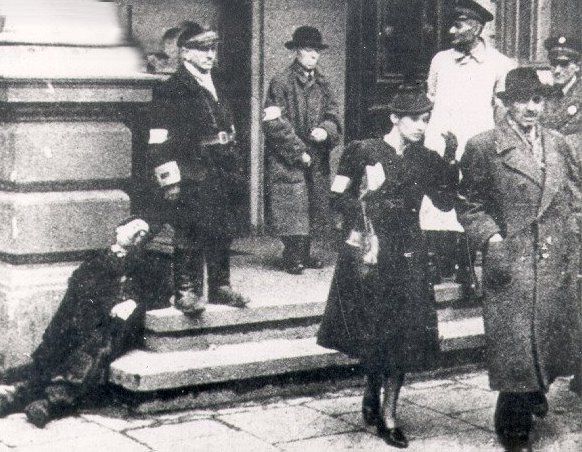 Jews wearing armbands in front of the Judenrat building in the Warsaw ghetto.